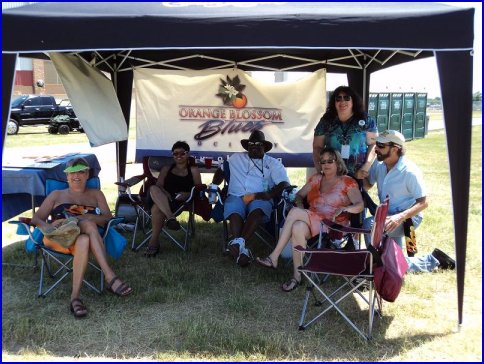 Orange Blossom Blues Society tent and members